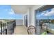 Private balcony with scenic views and outdoor seating at 101 Benjamin Franklin Dr # 54, Sarasota, FL 34236