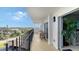 Spacious condo balcony with city views, featuring a small table and chairs for outdoor relaxation at 101 Benjamin Franklin Dr # 54, Sarasota, FL 34236