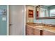 Vanity with granite countertop and wooden cabinets at 101 Benjamin Franklin Dr # 54, Sarasota, FL 34236
