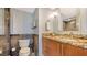 Bathroom with granite countertop and tiled shower at 101 Benjamin Franklin Dr # 54, Sarasota, FL 34236