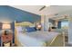 Bedroom with light-blue walls and a ceiling fan at 101 Benjamin Franklin Dr # 54, Sarasota, FL 34236