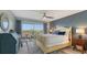 Second bedroom with water views and a ceiling fan at 101 Benjamin Franklin Dr # 54, Sarasota, FL 34236