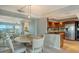 Charming dining area with a round table and four chairs at 101 Benjamin Franklin Dr # 54, Sarasota, FL 34236