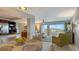 Bright dining area with a view of the living room at 101 Benjamin Franklin Dr # 54, Sarasota, FL 34236