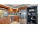 Modern kitchen with stainless steel appliances and wood cabinets at 101 Benjamin Franklin Dr # 54, Sarasota, FL 34236