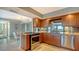 Updated kitchen featuring stainless steel appliances and wood cabinets at 101 Benjamin Franklin Dr # 54, Sarasota, FL 34236