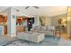 Spacious living area featuring a light grey couch and coffee table at 101 Benjamin Franklin Dr # 54, Sarasota, FL 34236