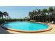 Relaxing kidney-shaped pool with ocean view at 101 Benjamin Franklin Dr # 54, Sarasota, FL 34236