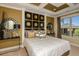 Main bedroom with an accent wall and plenty of natural light at 10220 Silent Night Ln, Sarasota, FL 34241