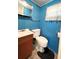 Small bathroom with toilet, sink, and vanity at 103 Oakwood Blvd, Sarasota, FL 34237