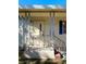 Mobile home's front entrance with steps and covered porch at 103 Oakwood Blvd, Sarasota, FL 34237