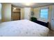 Main bedroom with a large bed, dresser, and closet at 103 Oakwood Blvd, Sarasota, FL 34237
