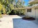 Large concrete patio area with covered carport at 103 Oakwood Blvd, Sarasota, FL 34237