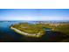 Aerial view of waterfront community with lush landscaping at 114 Tidy Island Blvd, Bradenton, FL 34210
