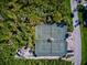 Aerial view of two tennis courts and surrounding landscape at 114 Tidy Island Blvd, Bradenton, FL 34210