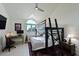Cozy bedroom with a bunk bed, desk and chair and large window at 114 Tidy Island Blvd, Bradenton, FL 34210