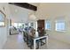 Bright dining room with a large farmhouse table and access to living room at 114 Tidy Island Blvd, Bradenton, FL 34210