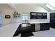 Modern kitchen featuring a stainless steel sink, sleek countertops, and stainless steel appliances at 114 Tidy Island Blvd, Bradenton, FL 34210