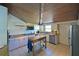 Bright kitchen featuring stainless steel appliances and wood ceiling at 114 Tidy Island Blvd, Bradenton, FL 34210
