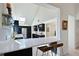 Modern kitchen featuring a breakfast bar, sleek countertops, and stainless steel appliances at 114 Tidy Island Blvd, Bradenton, FL 34210