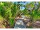 Wooden boardwalk path meandering through a lush natural landscape at 114 Tidy Island Blvd, Bradenton, FL 34210