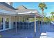 Spacious outdoor bar area with ample seating, perfect for entertaining guests with a waterfront view at 114 Tidy Island Blvd, Bradenton, FL 34210
