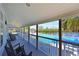 Community pool with covered deck and rocking chairs at 114 Tidy Island Blvd, Bradenton, FL 34210