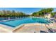 Stunning swimming pool with tropical greenery and lounge chairs at 114 Tidy Island Blvd, Bradenton, FL 34210