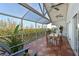 Spacious screened balcony with outdoor dining set and tranquil water views at 114 Tidy Island Blvd, Bradenton, FL 34210