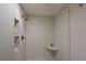 Modern walk-in shower with sleek tile, built-in niche, and a glass door at 114 Tidy Island Blvd, Bradenton, FL 34210
