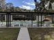 Covered shuffleboard courts with benches, offering a recreational amenity at 129 Brookshire Dr, Nokomis, FL 34275