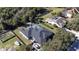 Aerial view of the house, pool, and surrounding landscape at 13634 7Th Avenue Ne Cir, Bradenton, FL 34212