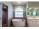 Bathroom with a free-standing bathtub, walk-in shower, and large window at 13634 7Th Avenue Ne Cir, Bradenton, FL 34212