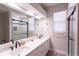 Dual vanity bathroom with modern fixtures, sleek design, and lots of natural light at 13634 7Th Avenue Ne Cir, Bradenton, FL 34212