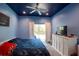 Bright bedroom with a king-size bed and sliding glass doors at 13634 7Th Avenue Ne Cir, Bradenton, FL 34212