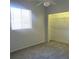 Bedroom with a window, closet, and neutral decor at 13634 7Th Avenue Ne Cir, Bradenton, FL 34212