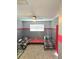 Shared bedroom with two twin beds, red accents, gray carpet, and a window providing natural light at 13634 7Th Avenue Ne Cir, Bradenton, FL 34212