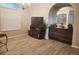 Dining room featuring an electric fireplace, built-in cabinets, and tile flooring at 13634 7Th Avenue Ne Cir, Bradenton, FL 34212