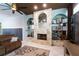 Stone fireplace with built-in shelving and arched accents at 13634 7Th Avenue Ne Cir, Bradenton, FL 34212