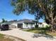 Well-kept single-story home with a two-car garage, featuring an inviting exterior, and landscaping at 13634 7Th Avenue Ne Cir, Bradenton, FL 34212