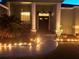 Front walkway and landscaping illuminated at night with holiday decor at 13634 7Th Avenue Ne Cir, Bradenton, FL 34212