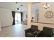 Open floor plan with hardwood floors connects the living and dining areas at 13634 7Th Avenue Ne Cir, Bradenton, FL 34212