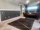 Spacious living room with tile floors and an antique piano at 13634 7Th Avenue Ne Cir, Bradenton, FL 34212