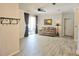 Open living space with hardwood floors, neutral walls, and sliding glass doors to the backyard at 13634 7Th Avenue Ne Cir, Bradenton, FL 34212