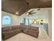 Inviting living room features tile floors, ceiling fan, and open floor plan to the kitchen at 13634 7Th Avenue Ne Cir, Bradenton, FL 34212
