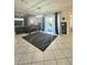 Large living room with tile flooring, piano and sliding glass doors to the pool area at 13634 7Th Avenue Ne Cir, Bradenton, FL 34212