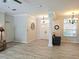 Spacious living area featuring hardwood floors, a decorative column, and plenty of natural light at 13634 7Th Avenue Ne Cir, Bradenton, FL 34212