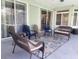 Covered patio with outdoor furniture, a ceiling fan and tile floors at 13634 7Th Avenue Ne Cir, Bradenton, FL 34212