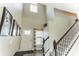 Bright entryway with tile flooring, staircase, and a view to the kitchen at 16108 62Nd E Gln, Parrish, FL 34219