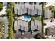 An aerial view of a complex featuring a central pool and surrounding townhouses at 1759 Dawn St # 308, Sarasota, FL 34231